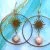 Boucles d’oreilles dorées en pierre de soleil avec pendentif soleil – fait main Boucles d’oreilles dorées en pierre de soleil avec pendentif soleil – fait main