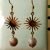 Boucles pierre de soleil et pendentif soleil doré