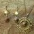 Collier doré avec pierre de soleil et pendentif soleil et boucle assortie